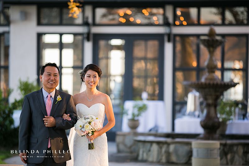 Bride and her father walk down the aisle to the ceremony gazebo at Summit House in Fullerton, CA